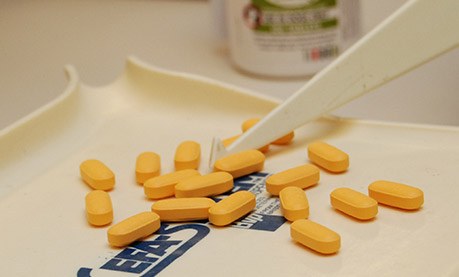 Pet medication tablets being counted – in-house pharmacy at Shiloh Veterinary Hospital